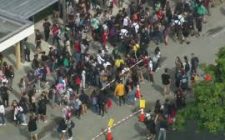 Dozens of students walk out of Western High School in support of security guard